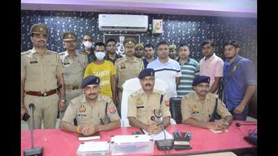 Senior police officials addressing mediapersons in Firozabad on Saturday (HT Photo)
