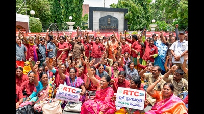Telangana State Road Transport Corporation (TSRTC) employees stage a protest outside Raj Bhavan over the delay in TSRTC merger draft bill approval in Hyderabad on Saturday. (PTI)