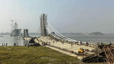 The bridge, a day after its collapse. (PTI) The bridge, a day after its collapse. (PTI)