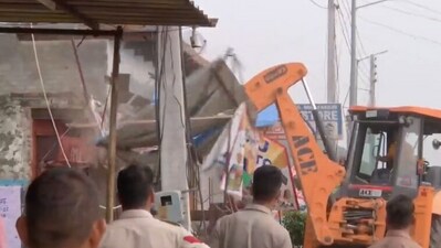 The Nuh administration demolished constructions on Nalhar Road that allegedly belonged to suspects involved in the communal clashes. (ANI)