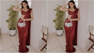 For her gorgeous look, Kajol played the muse for ace fashion designer Manish Malhotra and donned a deep maroon saree with metallic tubular sequins in a geometric pattern all over, complemented by a taban-cut blouse. (Instagram/@kajalaggarwalofficial) For her gorgeous look, Kajol played the muse for ace fashion designer Manish Malhotra and donned a deep maroon saree with metallic tubular sequins in a geometric pattern all over, complemented by a taban-cut blouse. (Instagram/@kajalaggarwalofficial)