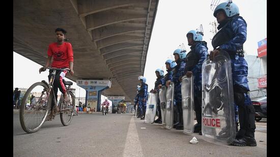 Rapid Action Force(RAF) has been deployed at Gurugram-Sohna road in Badshahpur village to maintain law and order on Saturday, (Parveen Kumar/HT)