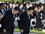 Japan's Prime Minister Fumio Kishida, front right, observes a moment of silence during a ceremony marking the 78th anniversary of the world's first atomic bombing at the Hiroshima Peace Memorial Park in Hiroshima, western Japan Sunday. Japan's Prime Minister Fumio Kishida, front right, observes a moment of silence during a ceremony marking the 78th anniversary of the world's first atomic bombing at the Hiroshima Peace Memorial Park in Hiroshima, western Japan Sunday.