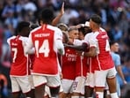 Arsenal's Leandro Trossard celebrates scoring their first goal with teammates