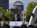 Japan’s Prime Minister Fumio Kishida speaks in front of the Cenotaph for Atomic Bomb Victims and the Atomic Bomb Dome in the Peace Memorial Park during the Presidency Press Conference of the G7 Hiroshima Summit in Hiroshima, Japan, 21 May 2023.