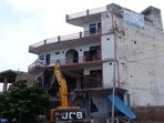 A hotel-cum-restaurant being demolished in Nuh. District administration says that it was built illegally and hooligans had pelted stones from during the recent violence. A hotel-cum-restaurant being demolished in Nuh. District administration says that it was built illegally and hooligans had pelted stones from during the recent violence.