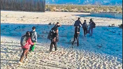 A screengrab of a video showing people illegally crossing over to the US via Mexico. (HT Photo) A screengrab of a video showing people illegally crossing over to the US via Mexico. (HT Photo)