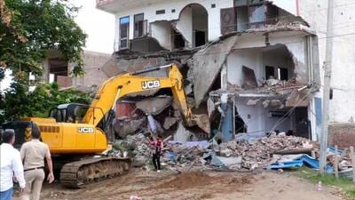 An illegal hotel being demolished in Nuh on Sunday. (HT Photo) An illegal hotel being demolished in Nuh on Sunday. (HT Photo)
