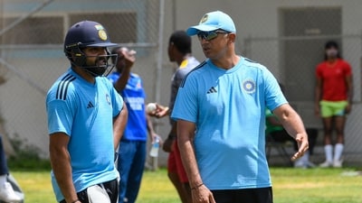 Rohit Sharma (L) and Rahul Dravid (R), of India, take part in a training session one day before the 1st ODI vs West Indies (AFP) Rohit Sharma (L) and Rahul Dravid (R), of India, take part in a training session one day before the 1st ODI vs West Indies (AFP)