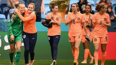 Netherlands players celebrate their victory after the end of the Australia and New Zealand 2023 Women's World Cup round of 16 football match between Netherlands and South Africa (AFP)