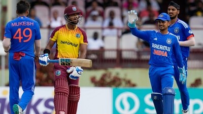 Ishan Kishan celebrates with Mukesh Kumar the dismissal of Nicholas Pooran during the second T20 match at Providence Stadium in Georgetown, Guyana (AP) Ishan Kishan celebrates with Mukesh Kumar the dismissal of Nicholas Pooran during the second T20 match at Providence Stadium in Georgetown, Guyana (AP)