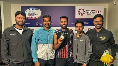 Badminton player HS Prannoy with coach P Gopichand and others poses for pictures with silver medal after the Australian Open men's singles final at the State Sports Centre in Sydney (PTI)