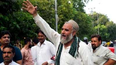 Supporters of Pakistan's former Prime Minister Imran Khan protest outside the Zaman park, in Lahore, Pakistan on Saturday. (AP) Supporters of Pakistan's former Prime Minister Imran Khan protest outside the Zaman park, in Lahore, Pakistan on Saturday. (AP)