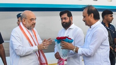 Union Home Minister Amit Shah being received by Maharashtra chief minister Eknath Shinde, deputy chief minister Ajit Pawar and others upon his arrival, in Pune on Saturday, (PTI) Union Home Minister Amit Shah being received by Maharashtra chief minister Eknath Shinde, deputy chief minister Ajit Pawar and others upon his arrival, in Pune on Saturday, (PTI)