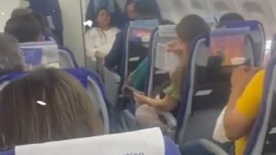 A passenger seen fanning himself inside the IndiGo flight. (X/Amarinder Singh Raja Warring) A passenger seen fanning himself inside the IndiGo flight. (X/Amarinder Singh Raja Warring)