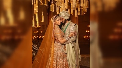 Ranveer Singh complemented Alia Bhatt in an ivory embroidered sherwani and a matching pagri. (Instagram/@manishmalhotra05) Ranveer Singh complemented Alia Bhatt in an ivory embroidered sherwani and a matching pagri. (Instagram/@manishmalhotra05)