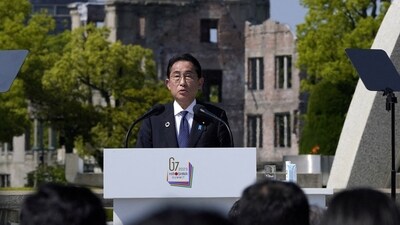 Japan’s Prime Minister Fumio Kishida speaks in front of the Cenotaph for Atomic Bomb Victims and the Atomic Bomb Dome in the Peace Memorial Park during the Presidency Press Conference of the G7 Hiroshima Summit in Hiroshima, Japan, 21 May 2023. (via REUTERS)