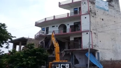 A hotel-cum-restaurant being demolished in Nuh. District administration says that it was built illegally and hooligans had pelted stones from during the recent violence. (ANI) A hotel-cum-restaurant being demolished in Nuh. District administration says that it was built illegally and hooligans had pelted stones from during the recent violence. (ANI)
