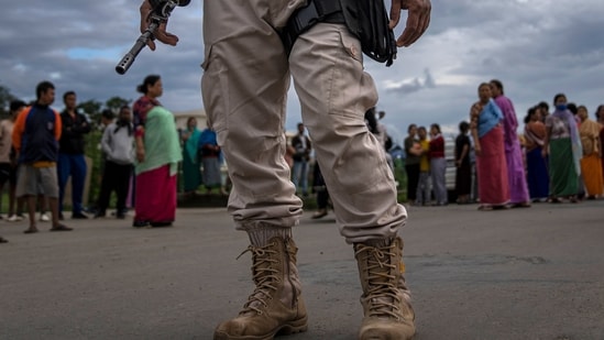 A Manipur policeman stands guard (AP)