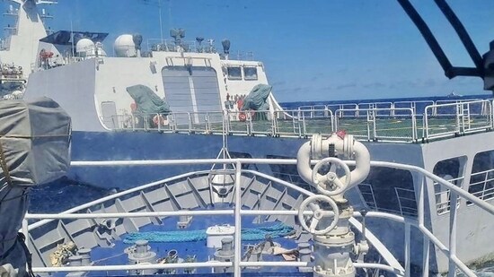 A China Coast Guard (front) blocking a Philippine Coast Guard ship near Second Thomas Shoal during a re-supply mission. (AFP)