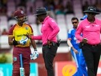 Nicholas Pooran (L) of the West Indies chats with umpires Leslie Reifer Jr. (C) and Nigel Duguid (R) during the 2nd T20I match between West Indies and India at Guyana National Stadium in Providence, Guyana, on August 6 Nicholas Pooran (L) of the West Indies chats with umpires Leslie Reifer Jr. (C) and Nigel Duguid (R) during the 2nd T20I match between West Indies and India at Guyana National Stadium in Providence, Guyana, on August 6