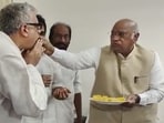 Congress president Mallikarjun Kharge offers sweets to TMC MP Derek O'Brien during celebrations of party leader Rahul Gandhi's Lok Sabha membership, Congress president Mallikarjun Kharge offers sweets to TMC MP Derek O'Brien during celebrations of party leader Rahul Gandhi's Lok Sabha membership,