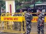 Paramilitary personnel stand guard during a protest by women of the Kwairamband Ima Keithel demanding an immediate call for an Assembly session in Manipur within a week regarding the Manipur issue, outside Raj Bhavan, in Imphal West on Friday. (ANI) Paramilitary personnel stand guard during a protest by women of the Kwairamband Ima Keithel demanding an immediate call for an Assembly session in Manipur within a week regarding the Manipur issue, outside Raj Bhavan, in Imphal West on Friday. (ANI)