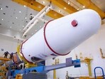 Technicians finishing to assemble a Soyuz 2.1b rocket carrying the Luna-25 lander ahead of its launch scheduled for August 11, 2023, at the Vostochny cosmodrome. 
