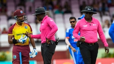 Nicholas Pooran (L) of the West Indies chats with umpires Leslie Reifer Jr. (C) and Nigel Duguid (R) during the 2nd T20I match between West Indies and India at Guyana National Stadium in Providence, Guyana, on August 6 (AFP) Nicholas Pooran (L) of the West Indies chats with umpires Leslie Reifer Jr. (C) and Nigel Duguid (R) during the 2nd T20I match between West Indies and India at Guyana National Stadium in Providence, Guyana, on August 6 (AFP)