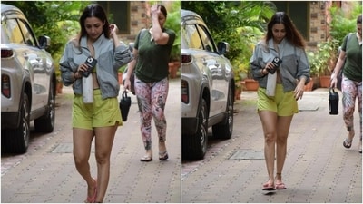 Malaika wore a sports bra and shorts set in a vibrant green shade, making a case for co-ord gym looks. While the sleeveless bra top features a plunging neckline, midriff-baring cropped hem, and fitted bust, the shorts have a mid-rise waist, side slits, and a relaxed silhouette. (HT Photo/Varinder Chawla, Instagram) Malaika wore a sports bra and shorts set in a vibrant green shade, making a case for co-ord gym looks. While the sleeveless bra top features a plunging neckline, midriff-baring cropped hem, and fitted bust, the shorts have a mid-rise waist, side slits, and a relaxed silhouette. (HT Photo/Varinder Chawla, Instagram)