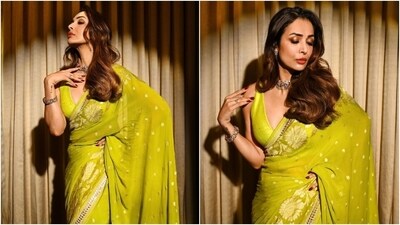 Malaika teamed the six yards with a matching sleeveless silk blouse featuring a plunging neckline, cropped hem, and a fitted silhouette. Lastly, a choker necklace, bracelet, jhumkis, side-parted wavy locks, shimmery bronze eye shadow, coral red lip shade, darkened brows, kohl-lined eyes, mascara on the lashes, rouged cheeks, and beaming highlighter gave the finishing touch. (HT Photo/Varinder Chawla, Instagram) Malaika teamed the six yards with a matching sleeveless silk blouse featuring a plunging neckline, cropped hem, and a fitted silhouette. Lastly, a choker necklace, bracelet, jhumkis, side-parted wavy locks, shimmery bronze eye shadow, coral red lip shade, darkened brows, kohl-lined eyes, mascara on the lashes, rouged cheeks, and beaming highlighter gave the finishing touch. (HT Photo/Varinder Chawla, Instagram)