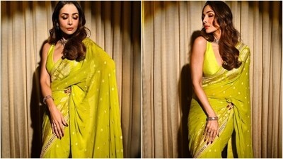 Today, Malaika Arora posted pictures of herself on Instagram, dressed in a gorgeous green-coloured saree by ace couturier Anita Dongre. She wore a Banarasi silk drape decked in gold brocade embroidery, hand-embellished cutdana work, and sequins. She wore it traditionally, with pleats on the front and pallu falling from the shoulder. (HT Photo/Varinder Chawla, Instagram) Today, Malaika Arora posted pictures of herself on Instagram, dressed in a gorgeous green-coloured saree by ace couturier Anita Dongre. She wore a Banarasi silk drape decked in gold brocade embroidery, hand-embellished cutdana work, and sequins. She wore it traditionally, with pleats on the front and pallu falling from the shoulder. (HT Photo/Varinder Chawla, Instagram)