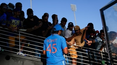 Rohit Sharma signs autograph after the third ODI cricket match between India and West Indies (AP) Rohit Sharma signs autograph after the third ODI cricket match between India and West Indies (AP)