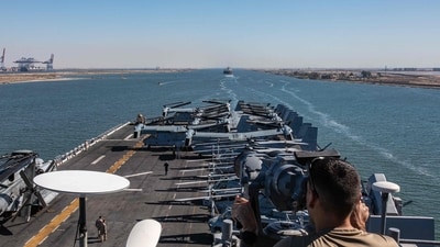 This handout photo released on August 6, 2023 by the US Defence Visual Information Distribution Service (DVIDS) shows A US Navy sailor from USS Bataan (LHD 5) monitoring as the amphibious assault ship transits the Suez Canal with the 26th Marine Expeditionary Unit (MEU). (AFP) This handout photo released on August 6, 2023 by the US Defence Visual Information Distribution Service (DVIDS) shows A US Navy sailor from USS Bataan (LHD 5) monitoring as the amphibious assault ship transits the Suez Canal with the 26th Marine Expeditionary Unit (MEU). (AFP)