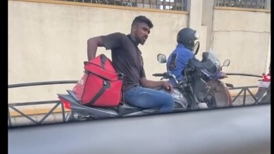 Zomato agent in Bengaluru seen eating food from delivery bag. Zomato agent in Bengaluru seen eating food from delivery bag.