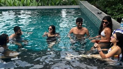 Sara Ali Khan was underwater in one of the photos as the friends hung out together. She wore glasses and kept her hair untied in the candid photo. Sara was in a white and yellow printed swimsuit. Sara Ali Khan was underwater in one of the photos as the friends hung out together. She wore glasses and kept her hair untied in the candid photo. Sara was in a white and yellow printed swimsuit. 