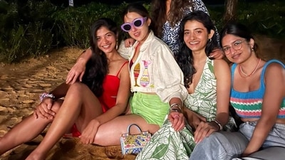 Sara Ali Khan and her friends posed for another group picture, this time on the sand. The actor chose a colourful look yet again – green shorts with a white shirt featuring pink and yellow fish embroidery. Sara Ali Khan and her friends posed for another group picture, this time on the sand. The actor chose a colourful look yet again – green shorts with a white shirt featuring pink and yellow fish embroidery. 