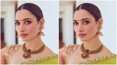 Styled by hairstylist Ratanti Pramanik, Tamannaah wore her tresses into a sleek bun with a middle part and white flowers adding more ethnic vibes to her look.&nbsp; (Instagram/@tamannaahspeaks)
