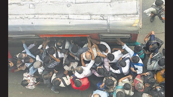 Mumbai, India - Aug. 7, 2023: Commuters wait for buses at a stop during a strike called by drivers of private bus operators, at Andheri, in Mumbai, India, on Monday, August 7, 2023. (Photo by Vijay Bate/ Hindustan Times) (Hindustan Times)
