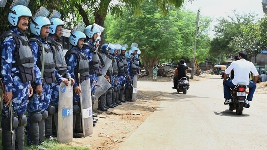 After the communal violence in Nuh, Rapid Action Force (RAF) has been deployed in sector-57 near Tigra Village to maintain law & order, in Gurugram, India, on Sunday. (Photo by Parveen Kumar/Hindustan Times)