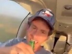 Garon Maia videoed himself swigging a beer while his son flew his plane. 