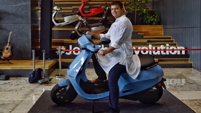 Bhavish Aggarwal, Co-founder and CEO of Ola, poses for a photograph with the new Ola electric scooter during its launch at the Ola headquarters in Bangalore on August 15, 2021. (AFP) Bhavish Aggarwal, Co-founder and CEO of Ola, poses for a photograph with the new Ola electric scooter during its launch at the Ola headquarters in Bangalore on August 15, 2021. (AFP)