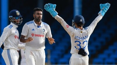 Ravichandran Ashwin (C) celebrates Ishan Kishan (R) (AFP) Ravichandran Ashwin (C) celebrates Ishan Kishan (R) (AFP)