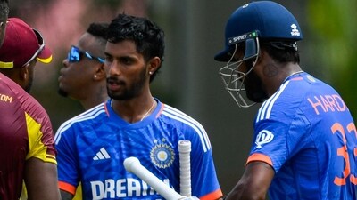 Tilak Varma (2R) and Hardik Pandya (R), of India, after winning the third T20I cricket match between India and West Indies at Guyana National Park in Georgetown, Guyana (AFP) Tilak Varma (2R) and Hardik Pandya (R), of India, after winning the third T20I cricket match between India and West Indies at Guyana National Park in Georgetown, Guyana (AFP)