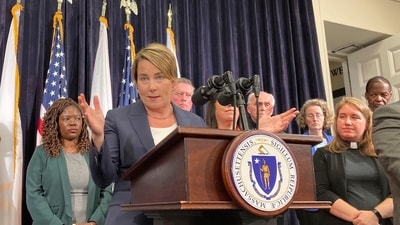 Massachusetts Gov. Maura Healey declares a state of emergency Tuesday, Aug. 8, 2023 in Boston, citing the influx of migrants to the state in need of shelter. Healey said there are nearly 5,600 families or more than 20,000 individuals – many of whom are migrants -- currently living in state shelter across Massachusetts. That's up from around 3,100 families a year ago, about an 80 percent increase. (AP Photo/Steve LeBlanc)