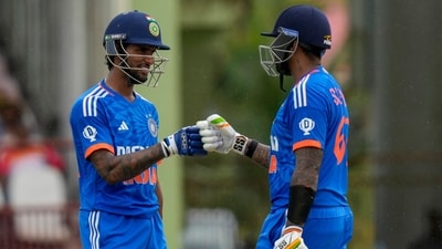 India's Tilak Varma (left) and Suryakumar Yadav knock gloves during their partnership. (AP) India's Tilak Varma (left) and Suryakumar Yadav knock gloves during their partnership. (AP)