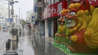 Typhoon Khanun: A main street is deserted as Typhoon Khanun approaches Naha city, Okinawa prefecture, southern Japan. (AP)