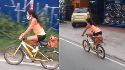 The image shows a bottle placed on the head of a woman riding a bike. (Facebook/@Marielle Amaba) The image shows a bottle placed on the head of a woman riding a bike. (Facebook/@Marielle Amaba)