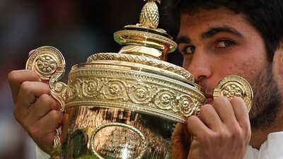 Spain's Carlos Alcaraz kisses the winner's trophy after beating Serbia's Novak Djokovic during their men's singles final tennis match on the last day of the 2023 Wimbledon Championships (AFP) Spain's Carlos Alcaraz kisses the winner's trophy after beating Serbia's Novak Djokovic during their men's singles final tennis match on the last day of the 2023 Wimbledon Championships (AFP)