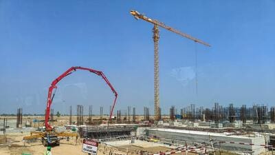 The Noida International Airport construction in April. According to Yeida officials, as the airport construction has progressed and it is expected to be operational by 2024, property buyers are showing interest in purchasing property in the developing areas along the Yamuna Expressway. (PTI)